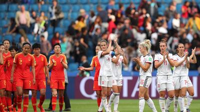 Players from China and Spain applaud the fans at the end of their Wormen's World Cup match. AP Photo