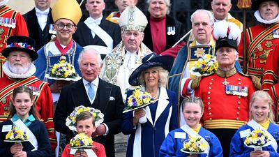 Prince Charles and Camilla, Duchess of Cornwall, pose for a group photo at St George's Chapel after the Maundy service at Windsor Castle. EPA