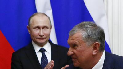 Vladimir Putin and Rosneft CEO Igor Sechin. The Russian oil major has reported record results. Reuters