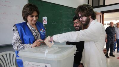 A man casts his vote at a polling station. AFP