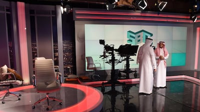 Fahad Shlayel, director general of Production and Programmes (R), talks to an employee at the studio of the new channel Saudi Broadcasting Corporation "SBC" in Riyadh, on April 24, 2018. Fayez Nureldine / AFP