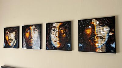 Lego artworks of The Beatles dominate one wall