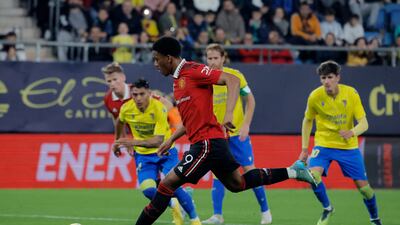 Manchester United's Anthony Martial scores his team's first goal from the penalty spot. Reuters