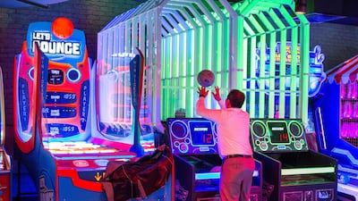 Fifty games are set over two floors in Levels Gaming, which also includes the world's largest Pac Man and the first three-axis rotation simulator 'Stereo VR'. Leslie Pableo / The National