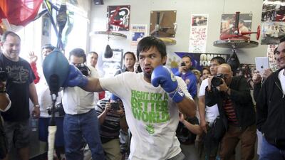 Manny Pacquiao trains on Wednesday, April 2, 2014, at the Wild Card Boxing Club in Los Angeles. Pacquiao is scheduled to fight Timothy Bradley on April 12 in a WBO welterweight title bout. Nick Ut / AP