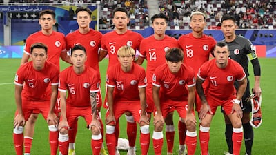 Hong Kong's players pose for a group photograph. AFP