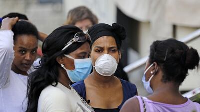 Ethiopian domestic workers wait outside their country's consulate to register for repatriation, in Hazmieh suburb of the Lebanese capital Beirut. AFP