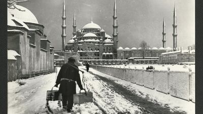 Sultan Ahmed Mosque, street seller in the snow. Taken by Othmar Pferschy, circa 1930