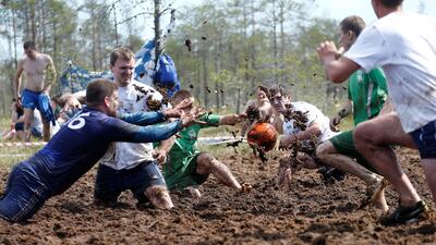 Soccer enthusiasts compete in the Swamp Football Cup of Russia in the village of Pogi in Leningrad Region, Russia June 16, 2018. Anton Vaganov / Reuters