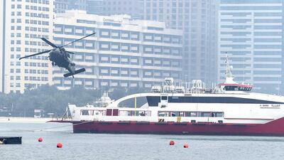 A narrator set the scene for the exercise, explaining the objectives of the display before four paratroopers jumped from an aircraft. Antonie Robertson / The National