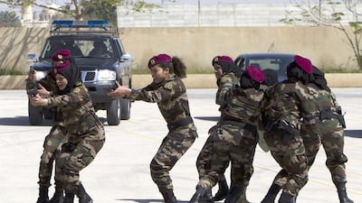 The trainees had responded to ads announcing the guards wanted recruits, but faced a tough selection process, with only a few dozen of the tallest and fittest being chosen. Ahmad Gharabli / AFP