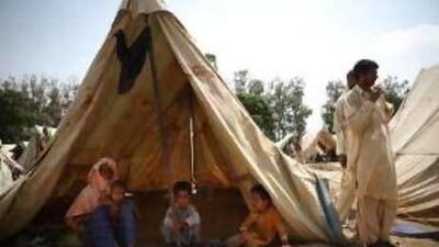 Flood victims in Pakistan find refuge in a relief camp in Punjab. Such tent cities are providing a breeding ground for infectious diseases.