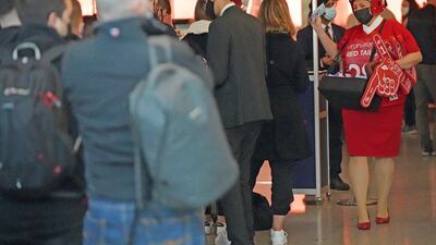 Passengers queue at Heathrow as the US reopens its borders to visitors from Britain