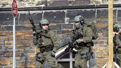 A Royal Canadian Mounted Police intervention team responds to the shooting at Parliament building in Ottawa on Wednesday October 22, 2014. Adrian Wyld / The Canadian Press / AP Photo
