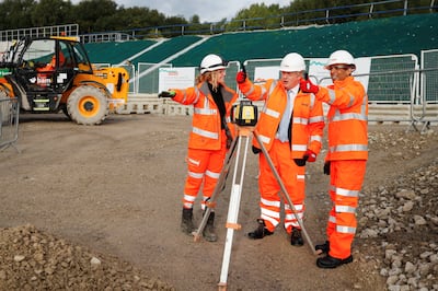 For Prime Minister Boris Johnson, centre, visiting a construction site in Manchester, levelling up was a vote winner. Getty Images