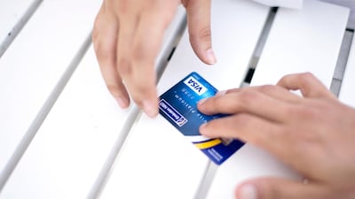 Much of the consumerist lifestyle in the West is oriented around spending more than you earn by using credit cards, then making the minimum monthly payment as your balance steadily increases. Photo: Reem Mohammed / The National