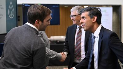 Rishi Sunak and Bill Gates meet members of R-Leaf at Imperial College London. Reuters