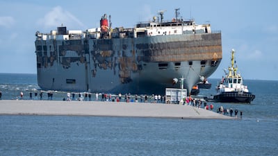 Stricken cargo ship Fremantle Highway is towed into the port of Eemshaven, the Netherlands, on August 3. AP