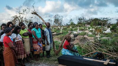 Rebecca Albino, a mother of three children, mourns beside the coffin of her husband during his funeral, following a strong cyclone that hit Beira, Mozambique. AFP
