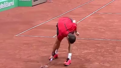 In this screenshot taken from YouTube, Grigor Dimitrov smashes the first of three rackets during the Istanbul Open final.