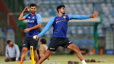 Bhuvneshwar Kumar, left, and Deepak Hooda attend a practice session at the Arun Jaitley Stadium. AFP