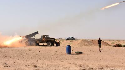 Syrian government forces fire a multiple rocket launcher from a position in Kobajjep area, on the south-western outskirts of Deir Ezzor, on September 5, 2017, during the ongoing battle against ISIL. AFP Photo