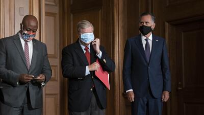 Republican senators, from left, Tim Scott, Lindsey Graham and Mitt Romney. Republicans are divided over the size and scope of additional federal spending. Bloomberg