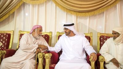 Sheikh Mohammed bin Zayed, centre, offers condolences to the family of martyr Mohammed Saeed Al Hassani, who passed away while serving with the UAE Armed Forces in Yemen. Mohamed Al Hammadi / Crown Prince Court - Abu Dhabi