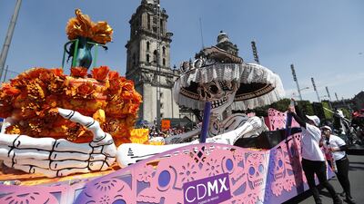 The day is filled with colourful decorations, street parties, music, dances and puppets. EPA