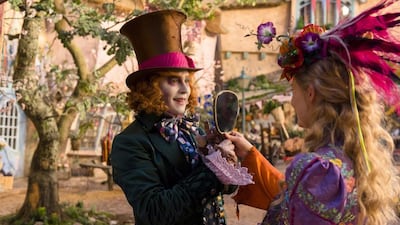 Johnny Depp, left, and Mia Wasikowska in Alice Through the Looking Glass. Emma Stone lost out on the role of Alice. Photo: Disney via AP