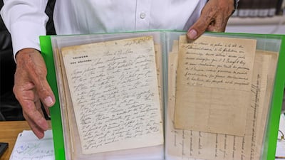 Khader holds a letter also written by Al Khalidi