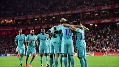 Paulinho Bezerra, centre, celebrates with his Barcelona teammates after scoring against Athletic Bilbao on Saturday. Alvaro Barrientos / AP Photo