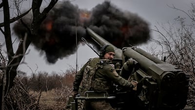 A Ukrainian soldier fires a howitzer towards Russian troops near Chasiv Yar in the Donetsk region. Reuters