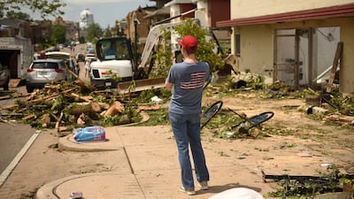 A Jefferson City resident takes photos of debris. Reuters
