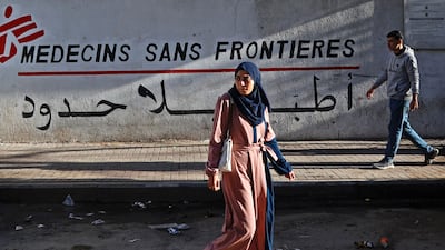 People walk past a clinic run by Doctors Without Borders (MSF) in Al Rimal, Gaza city. AFP