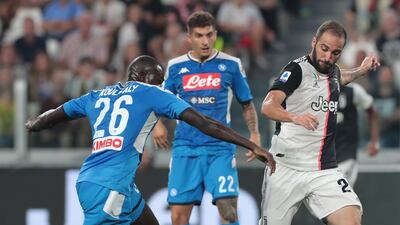 Gonzalo Higuain of Juventus scores against Napoli. Getty Images