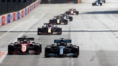 Lewis Hamilton overtakes Charles Leclerc's Ferrari at the start of the GP. Getty