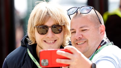 UFC fighter Paddy Pimblett poses with a fan. Reuters