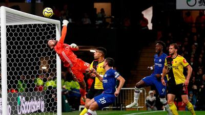 Watford's English goalkeeper Ben Foster (L) makes a save during the English Premier League football match between Watford and Chelsea at Vicarage Road Stadium in Watford, north of London on November 2, 2019. RESTRICTED TO EDITORIAL USE. No use with unauthorized audio, video, data, fixture lists, club/league logos or 'live' services. Online in-match use limited to 120 images. An additional 40 images may be used in extra time. No video emulation. Social media in-match use limited to 120 images. An additional 40 images may be used in extra time. No use in betting publications, games or single club/league/player publications. / AFP / Adrian DENNIS / RESTRICTED TO EDITORIAL USE. No use with unauthorized audio, video, data, fixture lists, club/league logos or 'live' services. Online in-match use limited to 120 images. An additional 40 images may be used in extra time. No video emulation. Social media in-match use limited to 120 images. An additional 40 images may be used in extra time. No use in betting publications, games or single club/league/player publications.