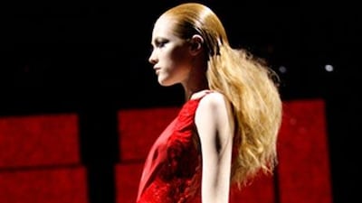 Versace's Fall/Winter 2009-10 collection is marked by classically draped satin dresses with embellishments.