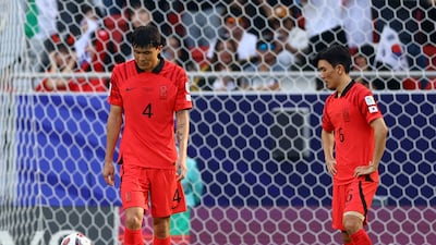 South Korea's Kim Min-jae looks dejected after Jordan's Yazan Al Naimat scores their second goal. Reuters