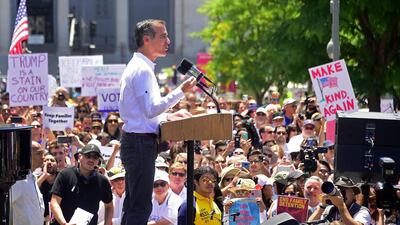 Los Angeles Mayor Eric Garcetti (C) addresses the crowd as people gather for a 'Familes Belong Together' March in Los Angeles, California on June 30, 2018 where a thousands turned out to decry the Trump administration's detention of families policy at the US Mexico border. Thousands of demonstrators, baking in the heat and opposed to the US immigration policy, marched across the country Saturday, June 30, 2018 to protest the separation of families under President Donald Trump's hardline agenda. / AFP / Frederic J. BROWN