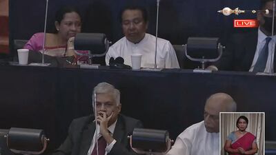 A screen grab of Mr Wickremesinghe, bottom left, during the vote count announcement in Sri Lanka's Parliament. AFP