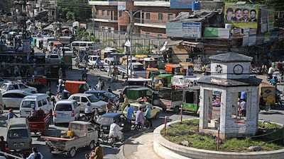 A general view of the crowded Raja Bazar is seen during a government-imposed nationwide lockdown as a preventive measure against the spread of the COVID-19 coronavirus, in Rawalpindi on May 5, 2020. (Photo by Aamir QURESHI / AFP)