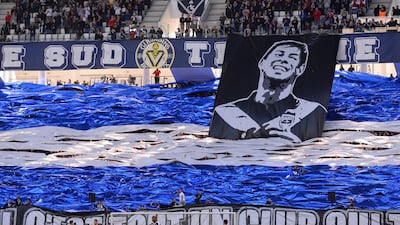 Bordeaux supporters display a banner depicting late Argentine footballer Emiliano Sala during the French Ligue 1 match against Toulouse at the Matmut Atlantique Stadium. AFP