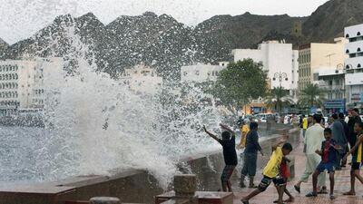 Children playing with high waves caused by the Cyclone Ashobaa along the coast in the Omani capital Muscat. The Sea of Oman will remain rough as rain clouds associated with the storm are only 60km away from Oman. Mohammed Mahjoub / AFP Photo