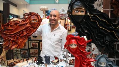 Remon Adel, an Egyptian expat who was inspired by the UAE culture, showcases his leather art at Abu Dhabi Mall. Ravindranath K / The National
