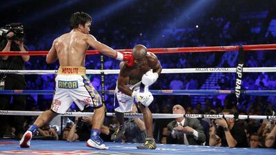 Manny Pacquiao, of the Philippines, fights Timothy Bradley during their WBO welterweight boxing bout Saturday, April 9, 2016, in Las Vegas. (AP Photo/Isaac Brekken)
