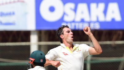 Australia bowler Pat Cummins celebrates after taking the wicket of Pakistan's Mohammad Rizwan for six. AFP