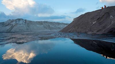 Two workers stand at the top of thousands of tons of salt product at the potash facility at Tees Docks. At around 1,400 metres deep it is the second deepest mine of this type in Europe and extends out to 7 kilometres under the North Sea. Ian Forsyth / Getty Images
